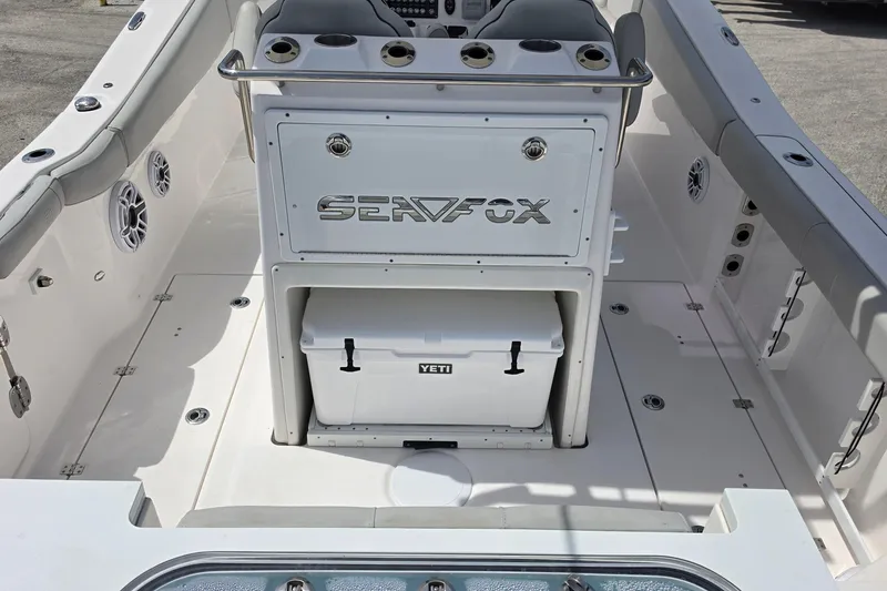Slide: The Image of 2023 Sea Fox 288 Commander boat interior with Yeti cooler and seating area. - 9
