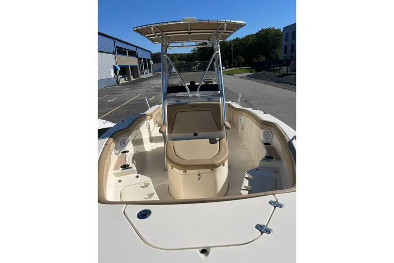 Slide: The Image of 2018 Scout 215 XSF boat interior with seating and storage compartments. - 5