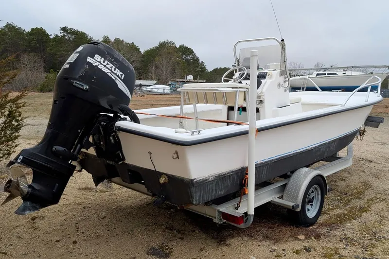 Slide: The Image of 2006 Twin Vee 19 BayCat boat with Suzuki outboard motor on trailer. - 3