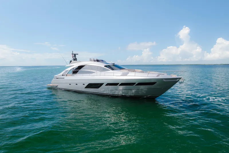 The Image of Luxurious 2021 Pershing 8X yacht cruising on open sea under clear blue sky. - 0