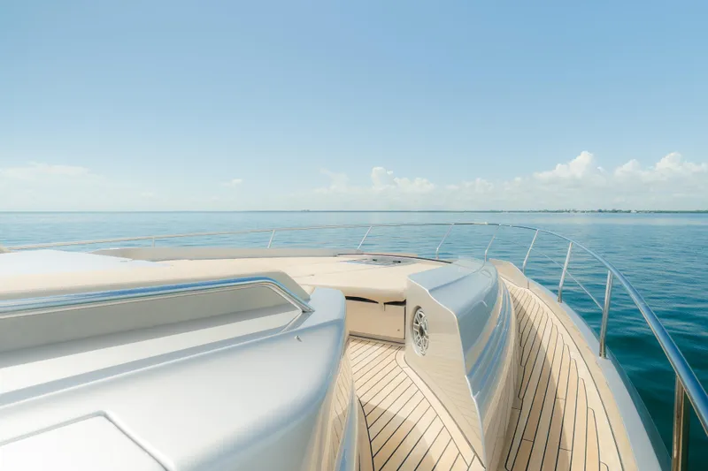 Slide: The Image of Luxurious 2021 Pershing 8X yacht deck with ocean view under clear blue sky. - 15