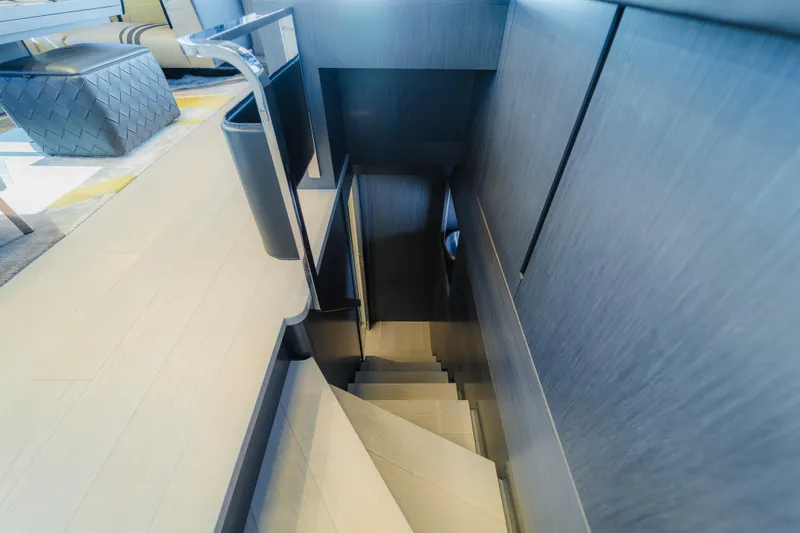 Slide: The Image of Staircase inside 2021 Pershing 8X yacht, featuring modern design and sleek finishes. - 16
