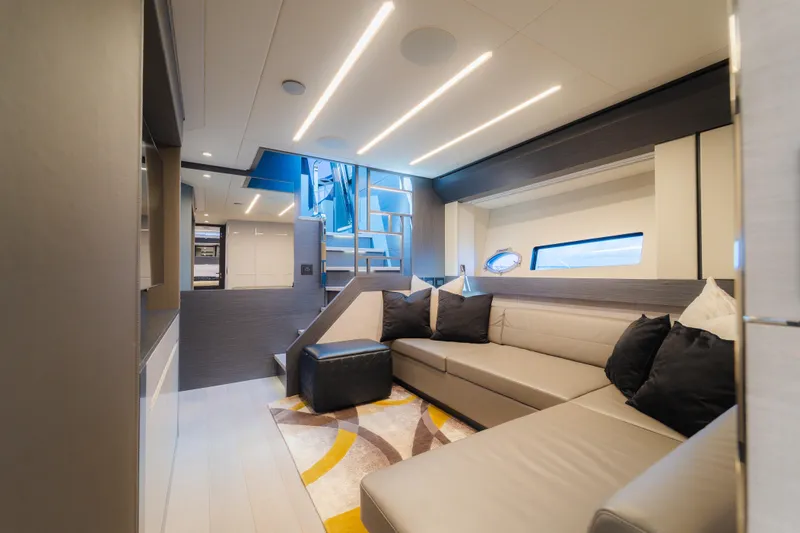Slide: The Image of Luxurious interior of 2021 Pershing 8X yacht with modern seating and elegant lighting. - 17