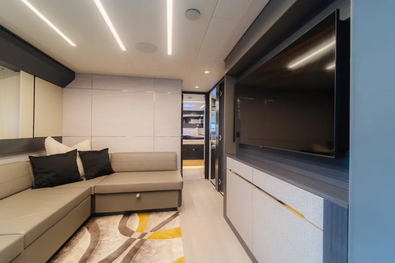 Slide: The Image of Luxurious interior of 2021 Pershing 8X yacht with modern sofa and large TV. - 18
