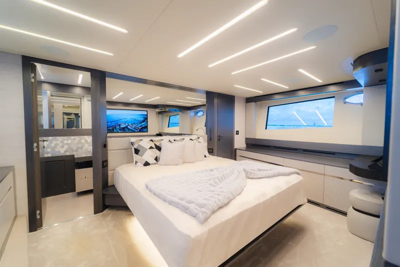 Slide: The Image of Luxurious interior of 2021 Pershing 8X yacht bedroom with modern design and ambient lighting. - 19