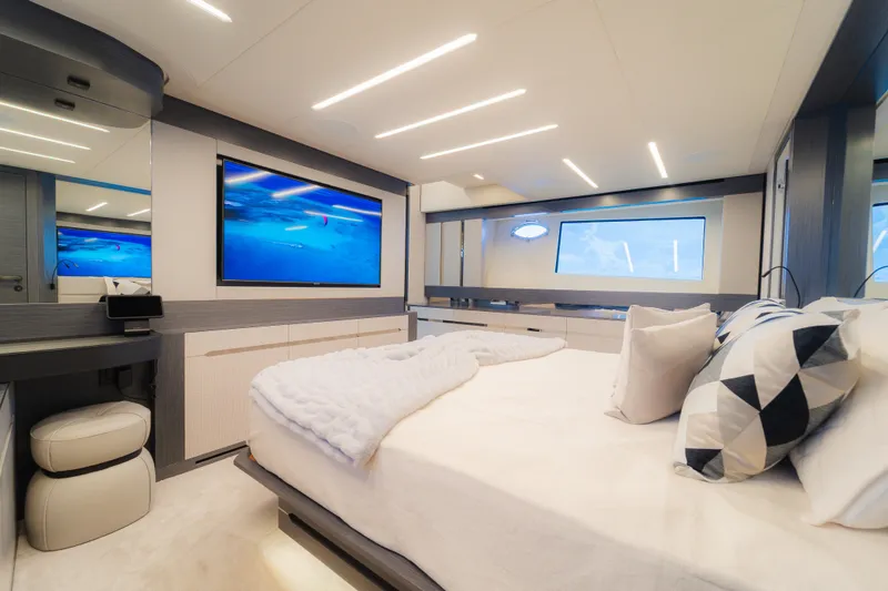 Slide: The Image of Luxurious bedroom interior of 2021 Pershing 8X yacht with modern decor and large windows. - 20