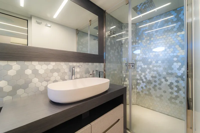 Slide: The Image of Modern bathroom in 2021 Pershing 8X yacht with hexagonal tile design. - 21