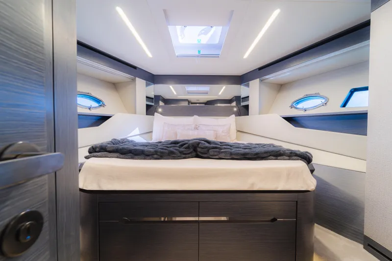 Slide: The Image of Luxurious bedroom interior of 2021 Pershing 8X yacht with modern design and skylight. - 22