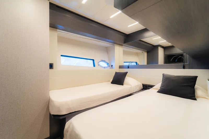 Slide: The Image of Luxurious twin bedroom interior on 2021 Pershing 8X yacht, featuring modern design. - 24