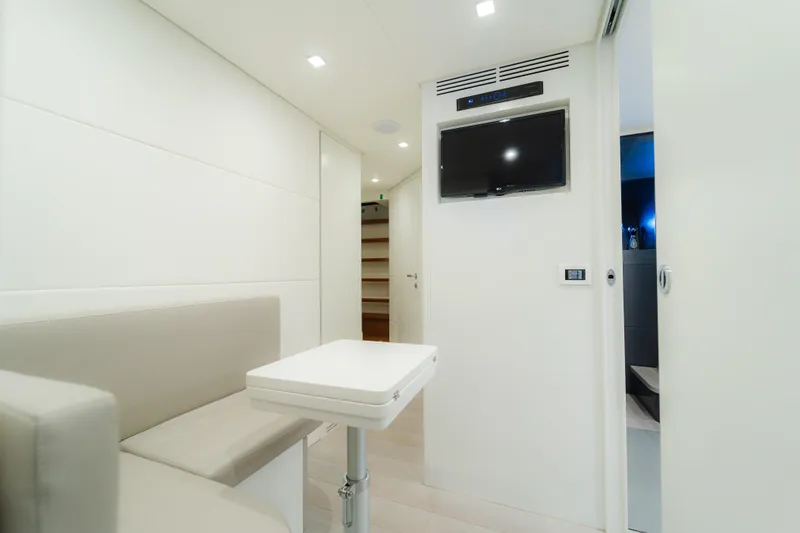 Slide: The Image of Modern interior of 2021 Pershing 8X yacht with sleek seating and wall-mounted TV. - 25