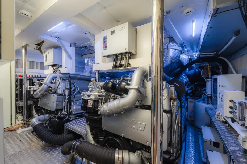 Slide: The Image of Engine room of a 2021 Pershing 8X yacht, featuring advanced machinery and equipment. - 27