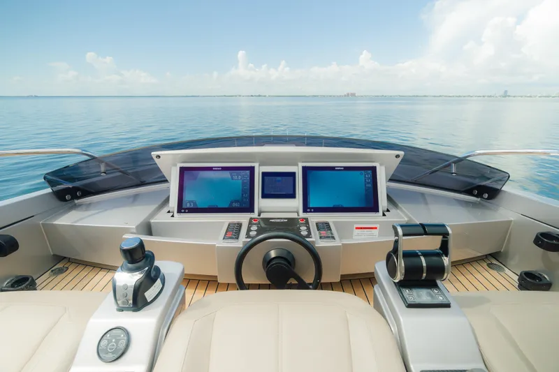 Slide: The Image of Cockpit view of 2021 Pershing 8X yacht with modern navigation screens and controls. - 28