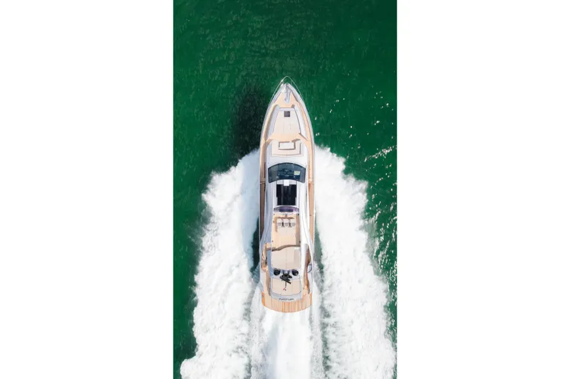 Slide: The Image of Aerial view of 2021 Pershing 8X yacht cruising on green water. - 4