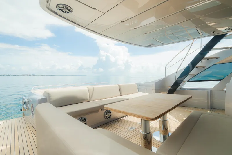Slide: The Image of Luxurious 2021 Pershing 8X yacht deck with elegant seating and ocean view. - 6