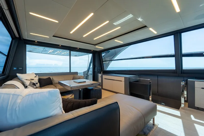 Slide: The Image of Luxurious interior of 2021 Pershing 8X yacht with modern furnishings and panoramic ocean views. - 9