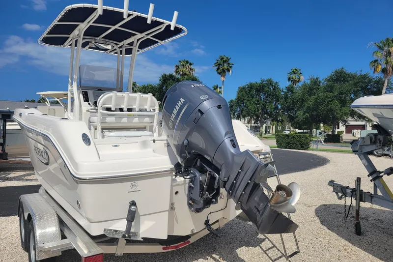 Slide: The Image of 2021 Robalo R200 Center Console boat with Yamaha outboard motor on trailer. - 1