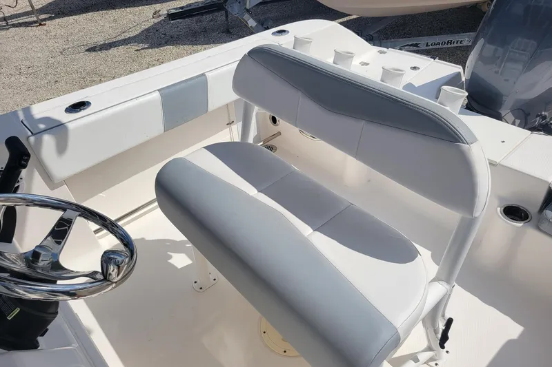Slide: The Image of 2021 Robalo R200 Center Console boat interior with steering wheel and seating. - 10