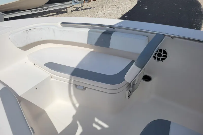 Slide: The Image of 2021 Robalo R200 Center Console boat interior with cushioned seating and speaker. - 11