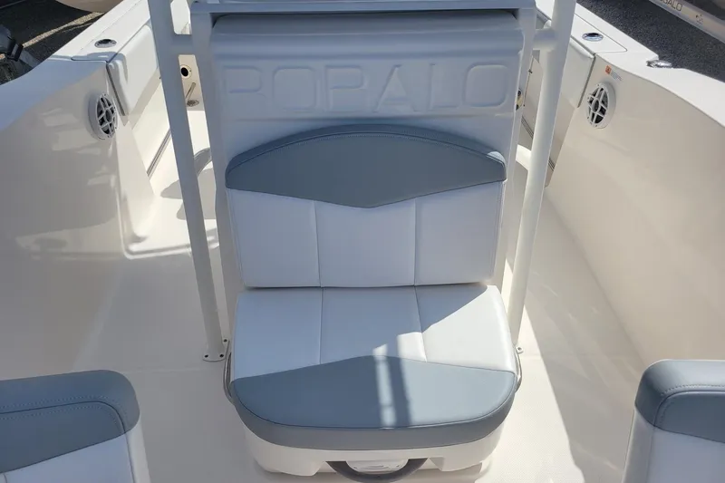 Slide: The Image of 2021 Robalo R200 Center Console boat seat with white and gray upholstery. - 12