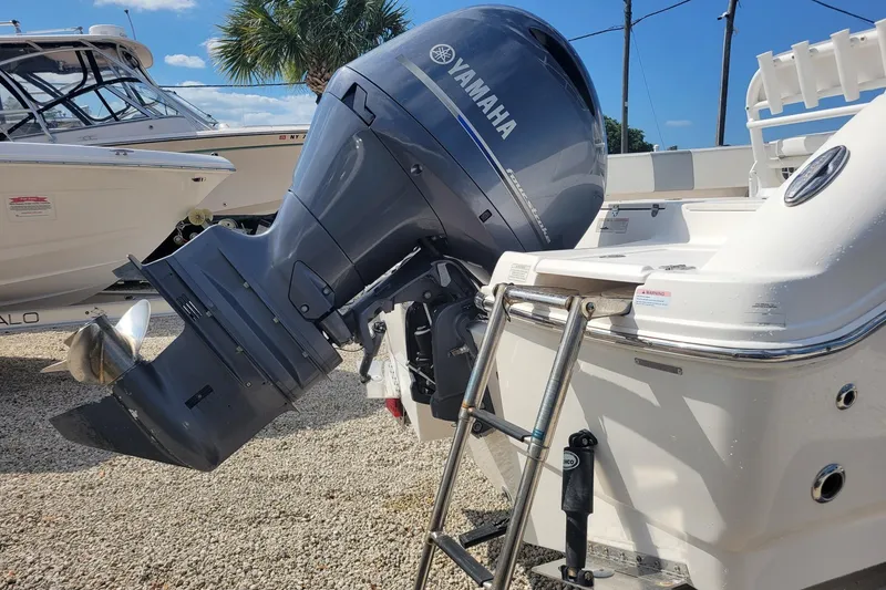 Slide: The Image of 2021 Robalo R200 Center Console with Yamaha outboard motor and ladder. - 2