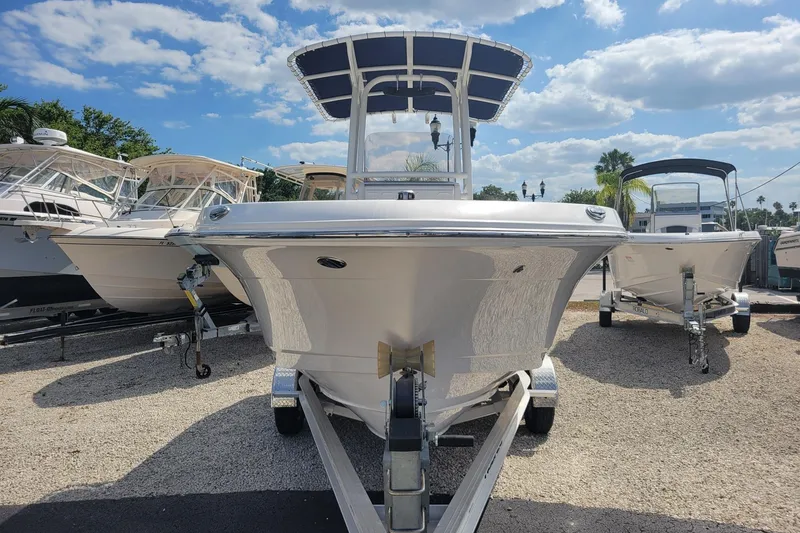 Slide: The Image of 2021 Robalo R200 Center Console boat on trailer under sunny sky. - 4