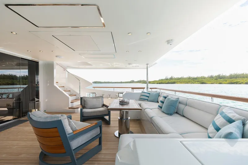 Slide: The Image of Luxurious 2018 Benetti Fast 125 yacht deck with elegant seating and scenic water views. - 11