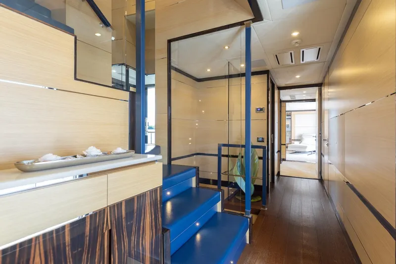 Slide: The Image of Luxurious interior of 2018 Benetti Fast 125 yacht with modern design and blue accents. - 16