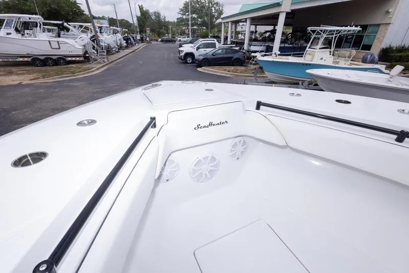 Slide: The Image of 2026 SeaHunter 33 Tournament boat interior at a dealership, showcasing sleek design and spacious layout. - 12