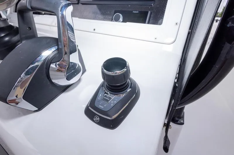 Slide: The Image of Control panel of 2026 SeaHunter 33 Tournament boat with joystick and throttle. - 13