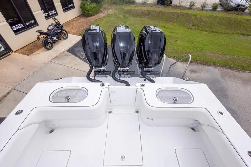 Slide: The Image of 2026 SeaHunter 33 Tournament boat with triple outboard engines, viewed from above. - 14