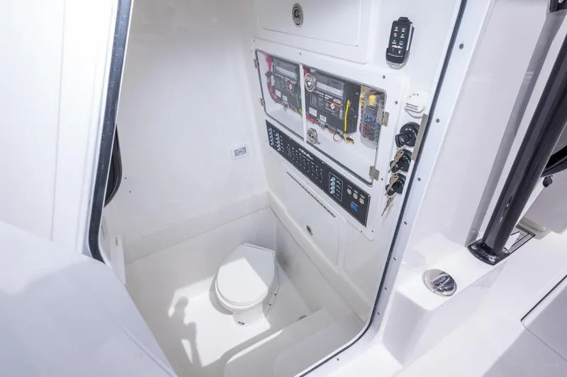 Slide: The Image of Interior of 2026 SeaHunter 33 Tournament boat with control panel and marine toilet. - 23