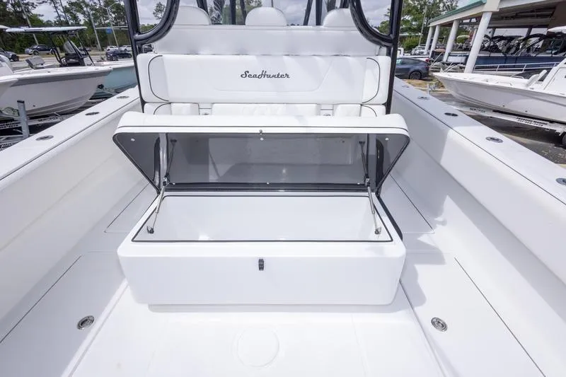 Slide: The Image of 2026 SeaHunter 33 Tournament boat interior with open storage compartment. - 24