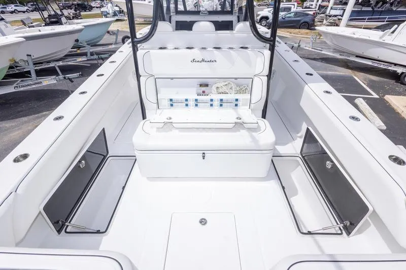 Slide: The Image of 2026 SeaHunter 33 Tournament boat interior with seating and storage compartments. - 27