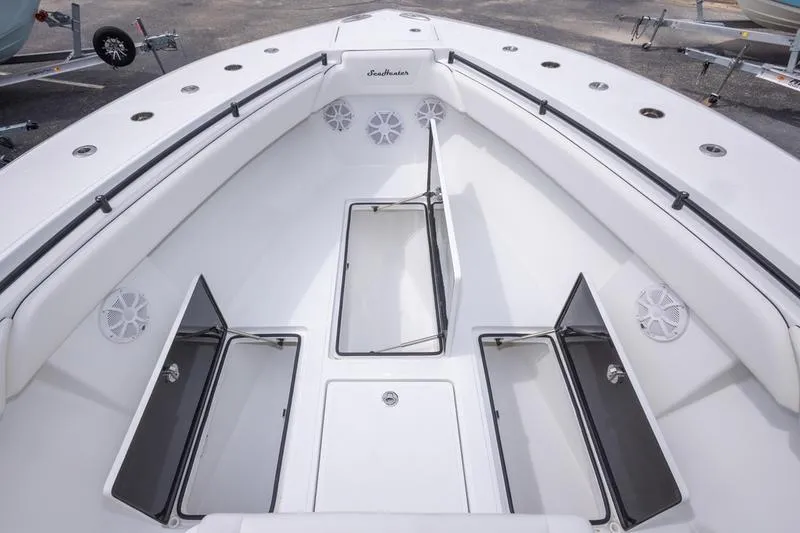 Slide: The Image of 2026 SeaHunter 33 Tournament boat interior with open storage compartments and seating. - 30