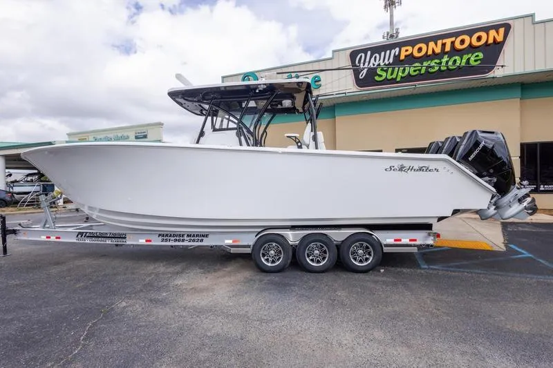 Slide: The Image of 2026 SeaHunter 33 Tournament boat on trailer at marine superstore. - 32
