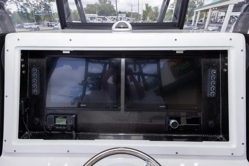 Slide: The Image of Dashboard of 2026 SeaHunter 33 Tournament boat with dual screens and controls. - 4