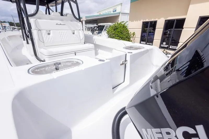 Slide: The Image of 2026 SeaHunter 33 Tournament boat interior with seating and storage compartments. - 42