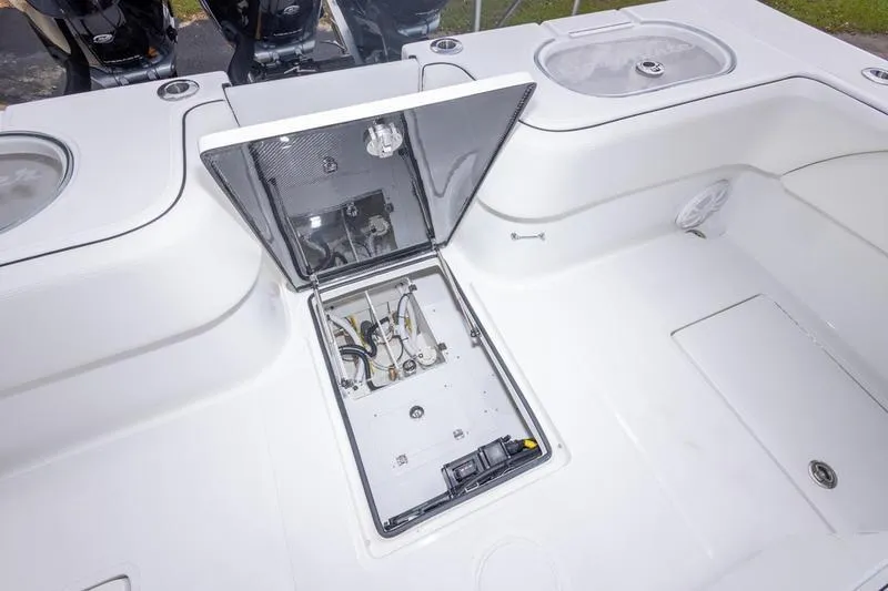 Slide: The Image of Open hatch on 2026 SeaHunter 33 Tournament boat deck, revealing internal components. - 48