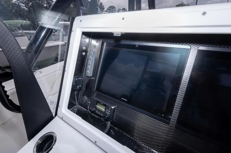 Slide: The Image of Dashboard of 2026 SeaHunter 33 Tournament boat with advanced navigation equipment. - 51