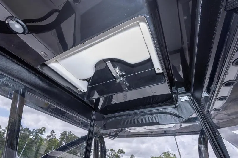 Slide: The Image of 2026 SeaHunter 33 Tournament boat interior ceiling with storage compartment. - 54
