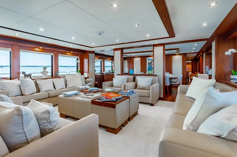 Slide: The Image of Luxurious interior of 2009 Sunseeker 121 yacht with plush seating and panoramic windows. - 10