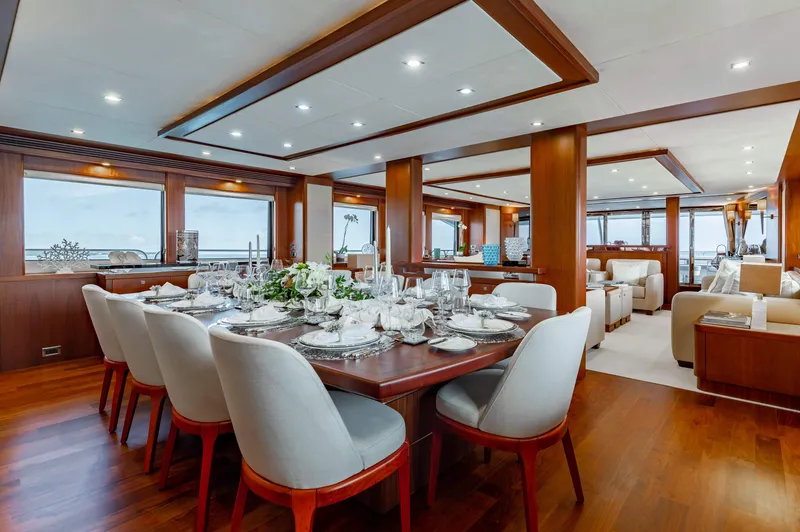 Slide: The Image of Luxurious dining area on a 2009 Sunseeker 121 yacht with elegant table setting. - 12
