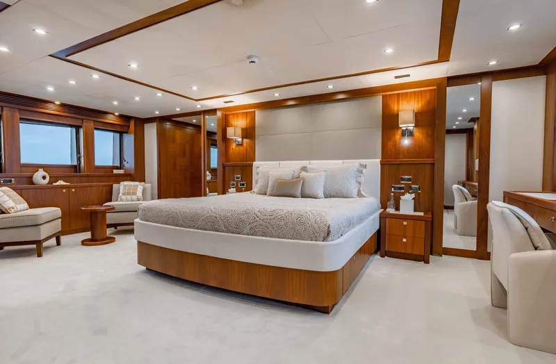 Slide: The Image of Luxurious master bedroom on a 2009 Sunseeker 121 yacht with modern decor. - 13