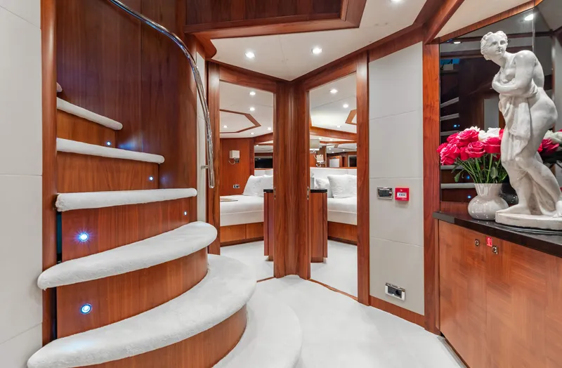 Slide: The Image of Luxurious interior of 2009 Sunseeker 121 yacht with elegant staircase and modern decor. - 16