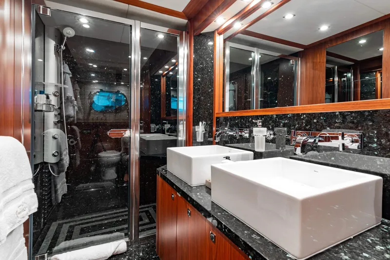 Slide: The Image of Luxurious bathroom on a 2009 Sunseeker 121 yacht with dual sinks and modern fixtures. - 19