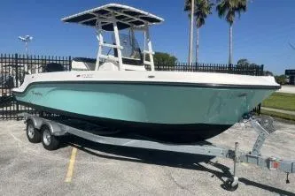 Slide: The Image of 2023 Trophy T22 boat on trailer, parked outdoors under clear sky. - 3