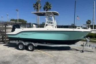 Slide: The Image of 2023 Trophy T22 boat on trailer, parked outdoors under clear sky. - 4