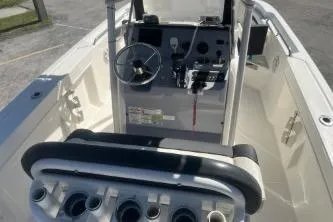 Slide: The Image of 2023 Trophy T22 boat interior with steering console and seating arrangement. - 9