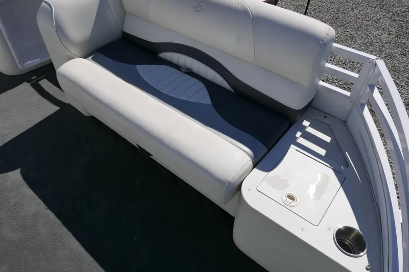 Slide: The Image of 2010 JC Neptoon 21TT boat seating area with white and gray upholstery. - 5