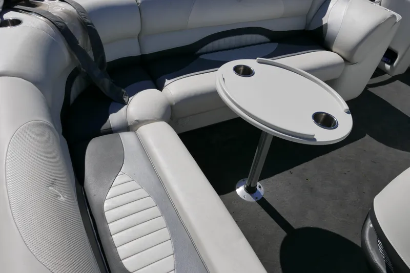 Slide: The Image of Interior of 2010 JC Neptoon 21TT pontoon boat with seating and table. - 9